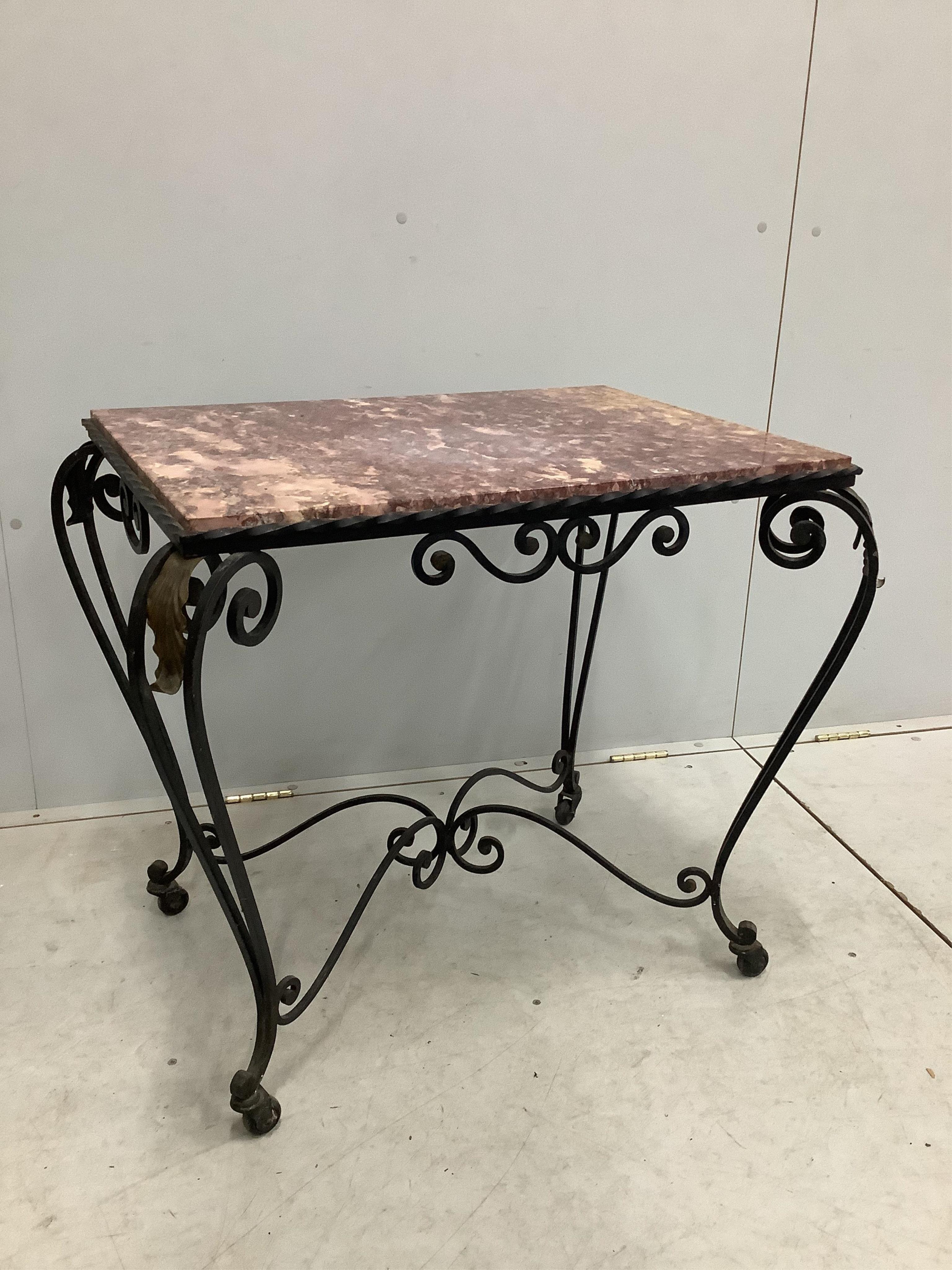 A rectangular wrought iron marble topped table, width 81cm, depth 58cm, height 68cm. Condition - fair